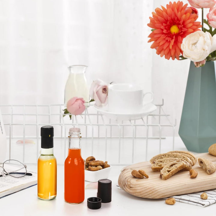 36 Pack Small Glass Bottle, 3oz/100ml Glass Woozy Bottle, Empty Mini Hot Sauce Bottles, Clear Liquor Wine Bottles with Shrink Capsule, Black Screw Caps, Dripper Insert - Just Closeouts Canada Inc.