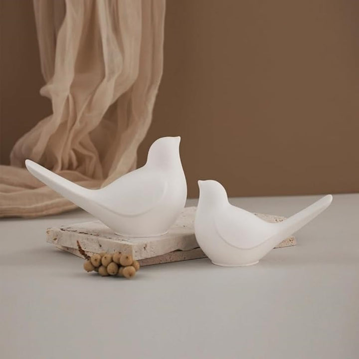 Two white bird-shaped silicone resin molds, view 6