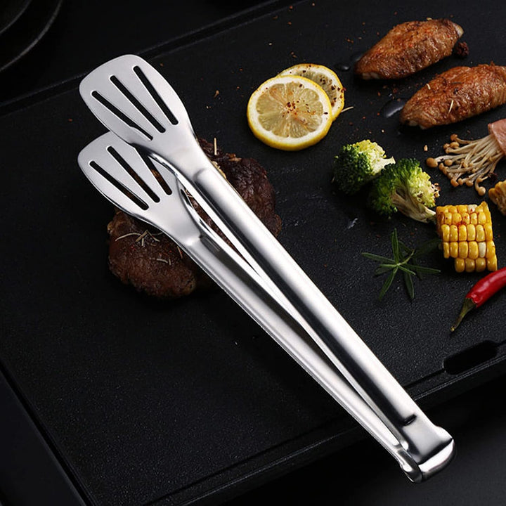 Stainless steel tong lifting grilled food