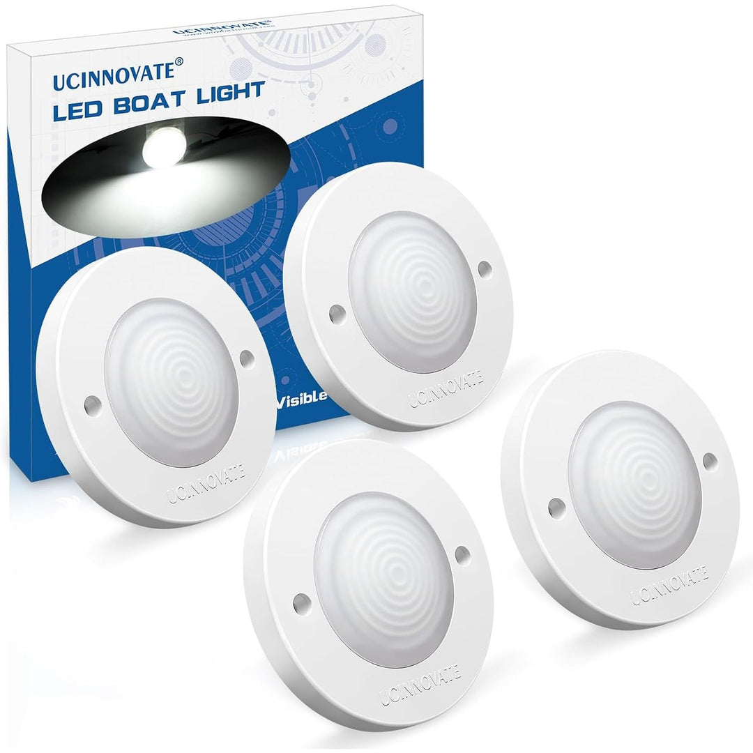 four round white LED marine lights with white housings