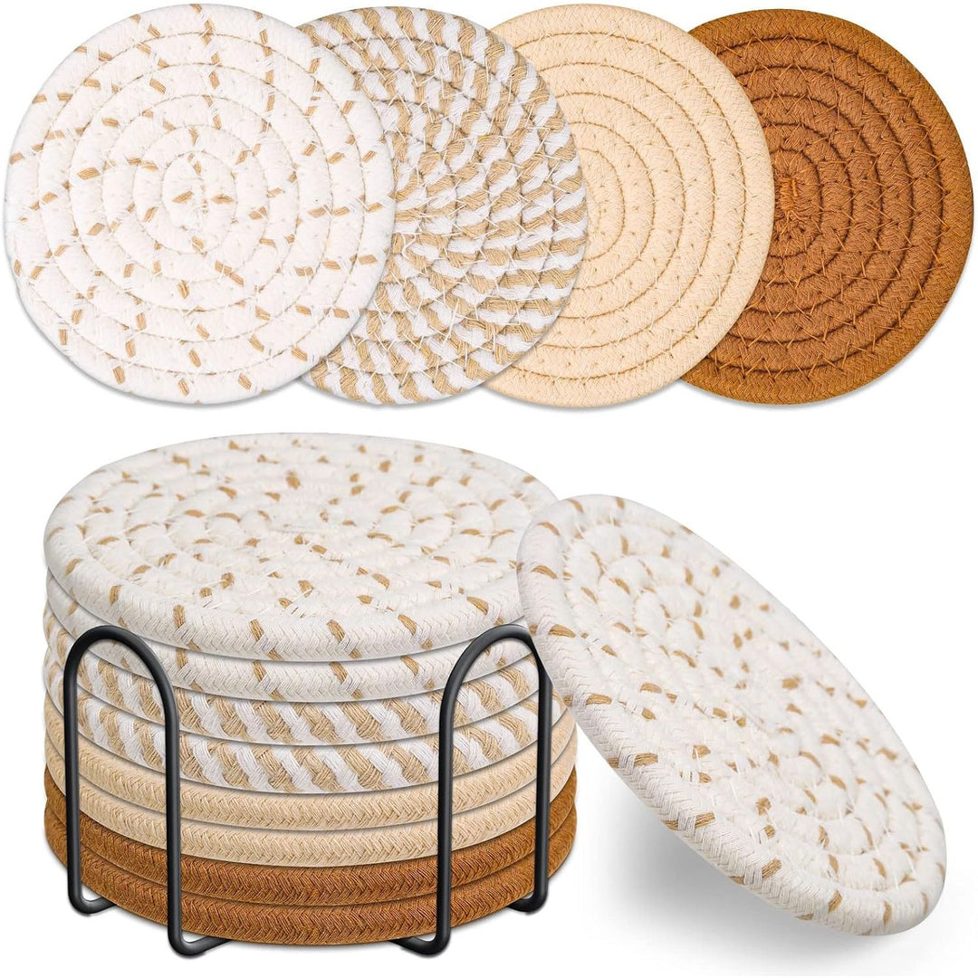 eight round woven coasters in four neutral shades with black holder