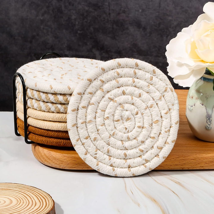 stack of neutral woven coasters in black holder
