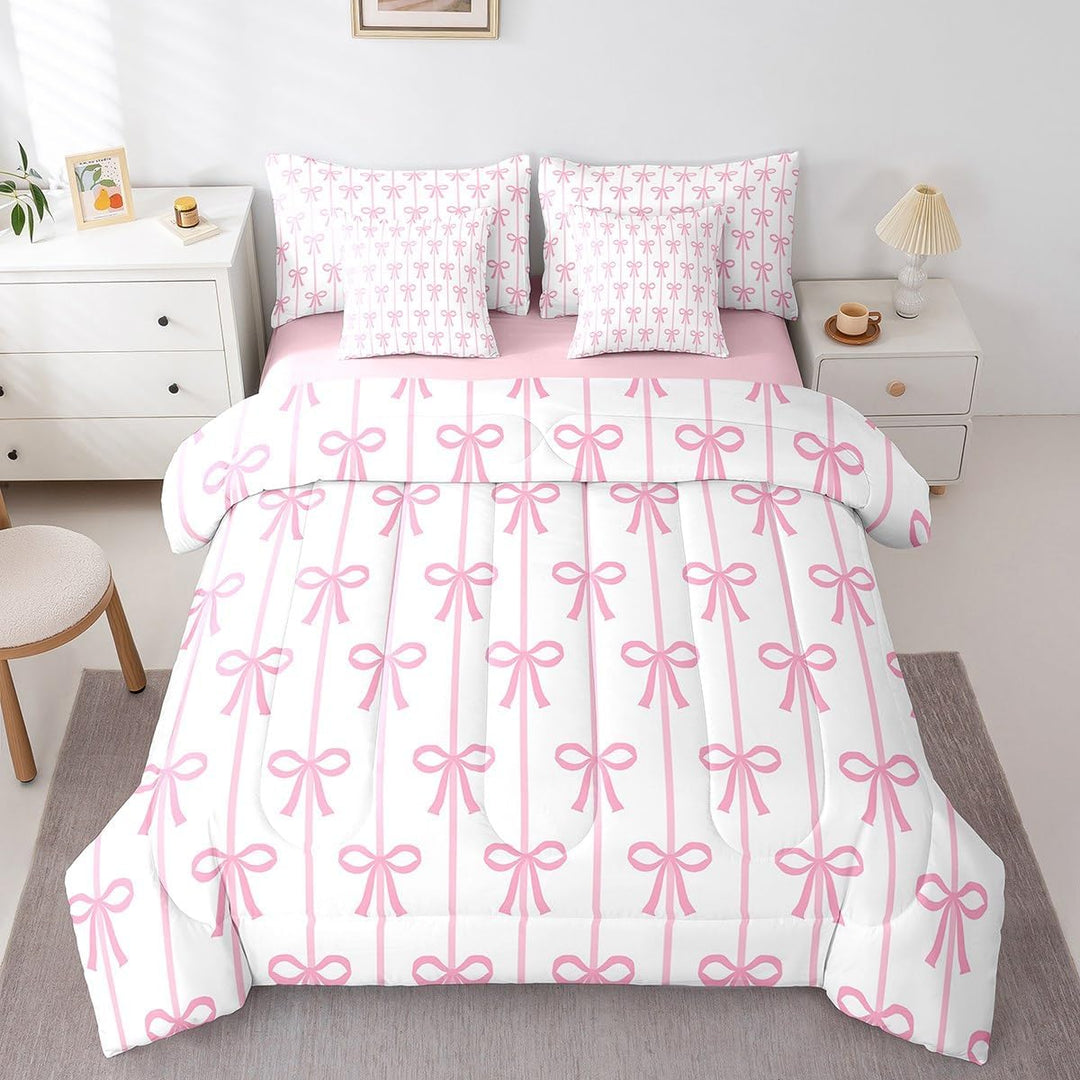 Full view of pink bow comforter and sheets