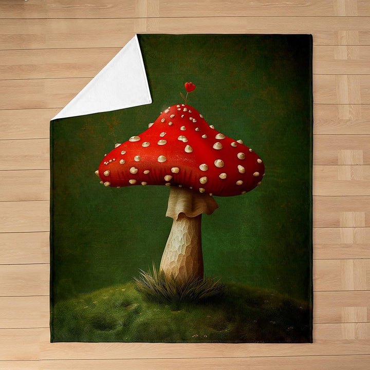 Red mushroom print blanket laid flat