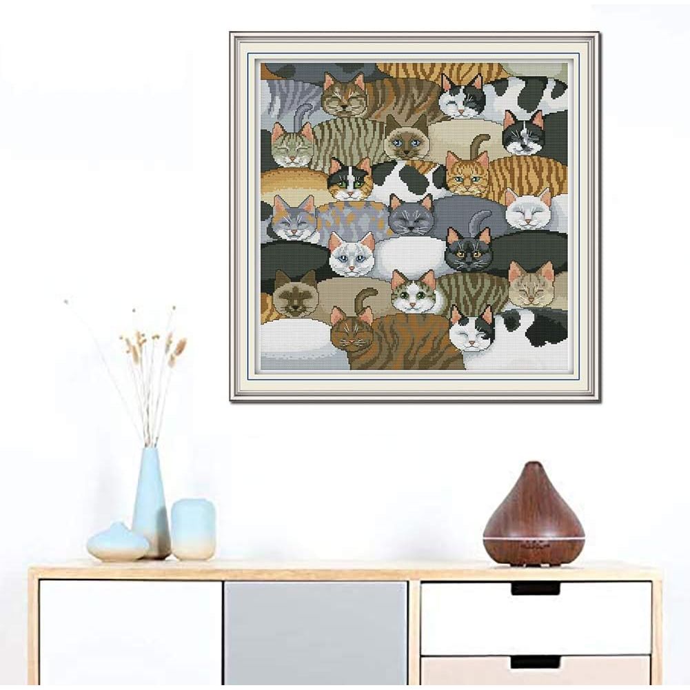 Cats cross-stitch artwork shown framed for display; frame not included