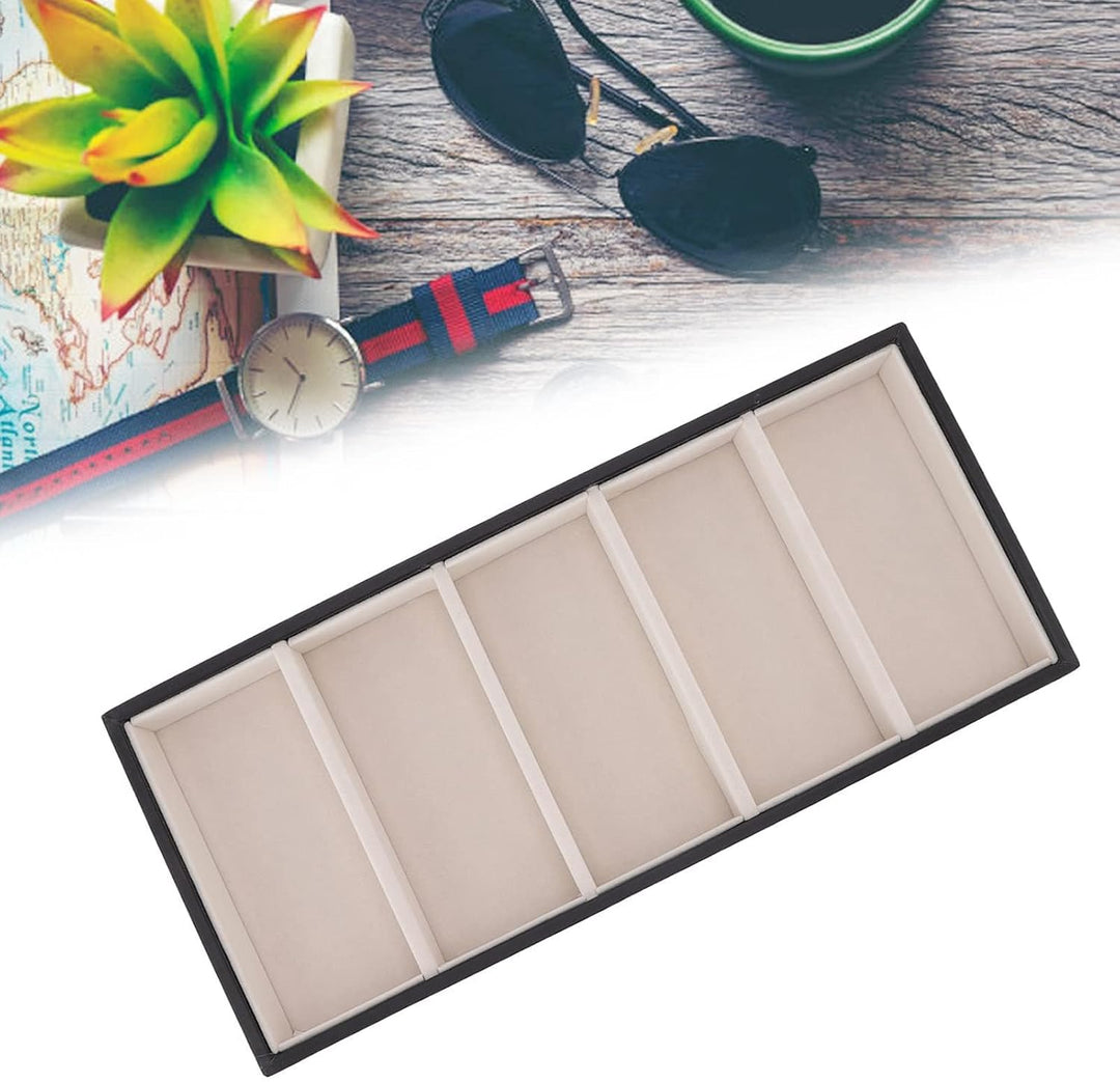 Empty five-slot black and beige display tray