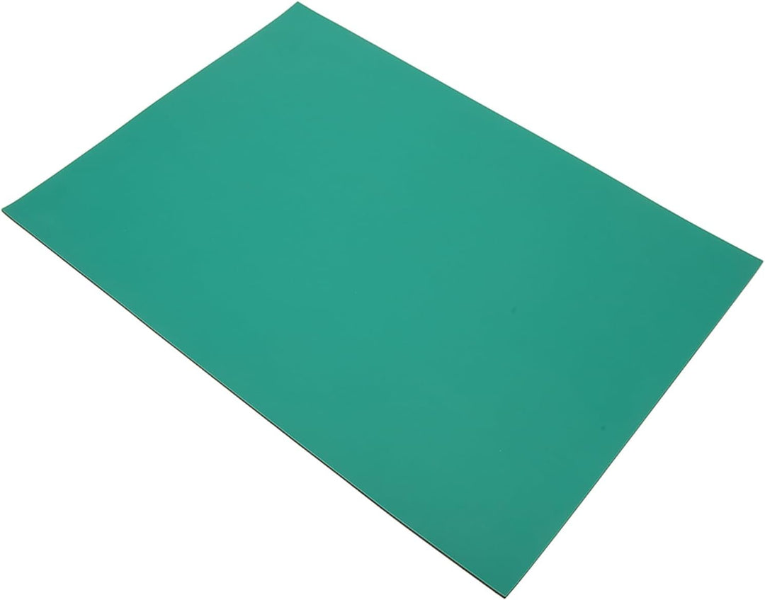 Green rectangular work mat on white background
