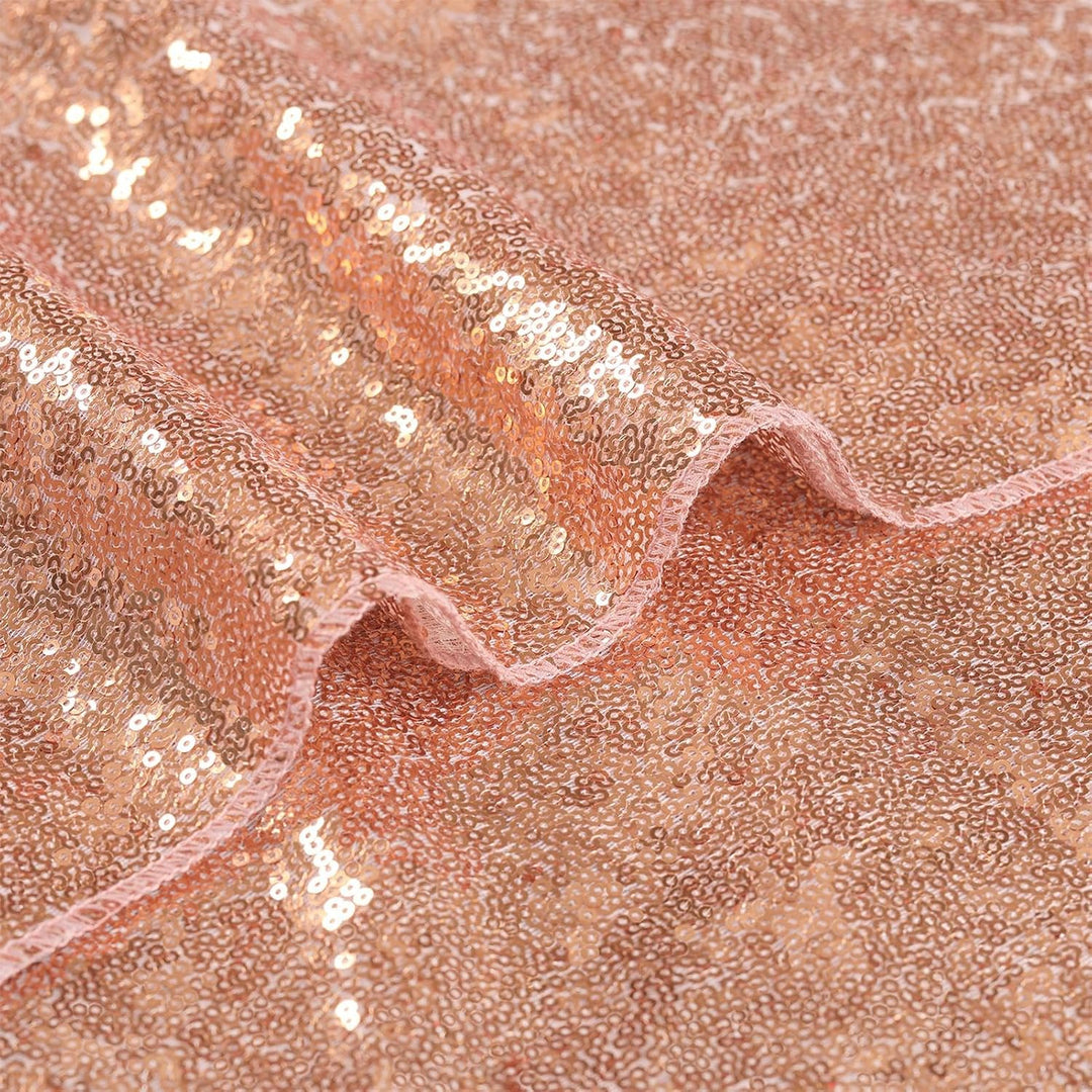 Close-up of rose-gold sequin runner fabric