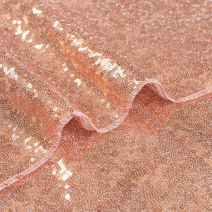 Close-up of rose-gold sequin runner fabric