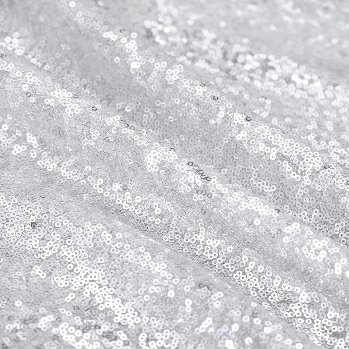 Close-up of silver sequin fabric texture