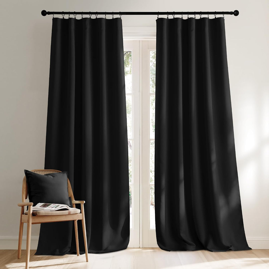 Black long curtains shown with clip rings in a room