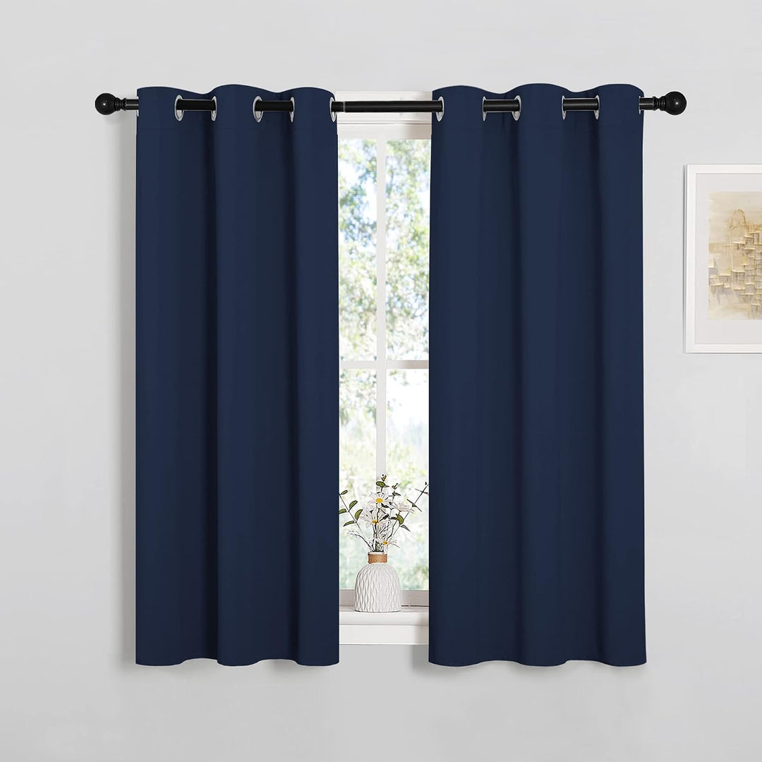 Navy blue 34 x 45 inch grommet curtains in a room