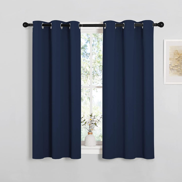 Navy blue 34 x 45 inch grommet curtains in a room