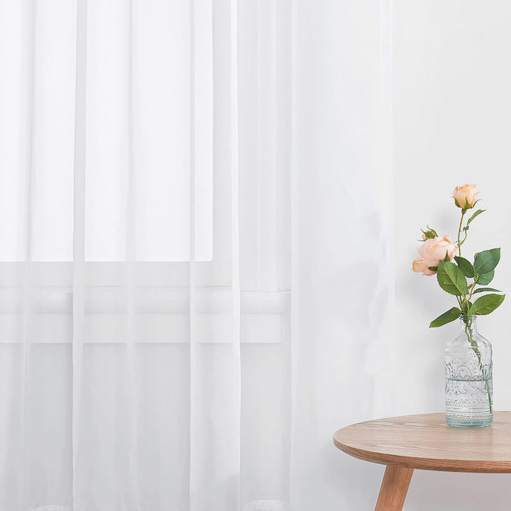 White sheer curtain light filtering