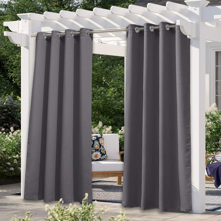 Grey waterproof outdoor blackout curtain on pergola, shown as two single panels