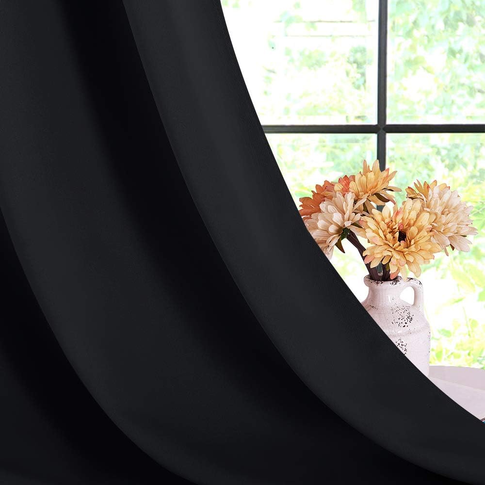 Blackout fabric draped by window