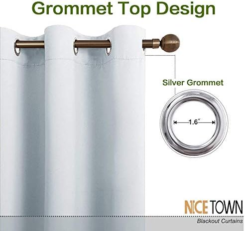 Silver grommet detail on greyish white wide curtain