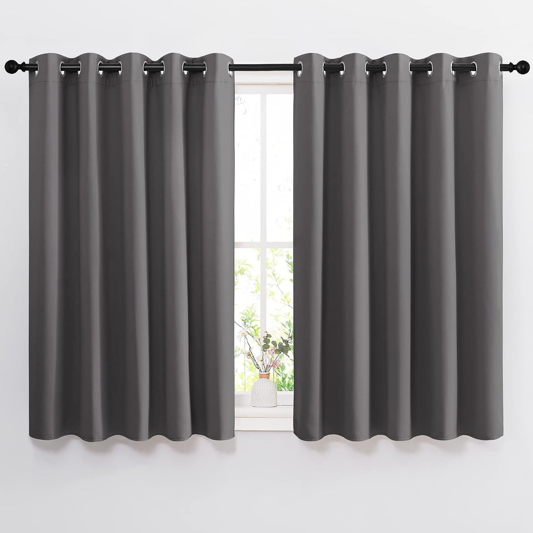Grey 66 by 54 inch blackout grommet curtain pair installed