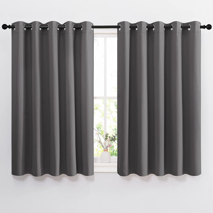 Grey 66 by 54 inch blackout grommet curtain pair installed