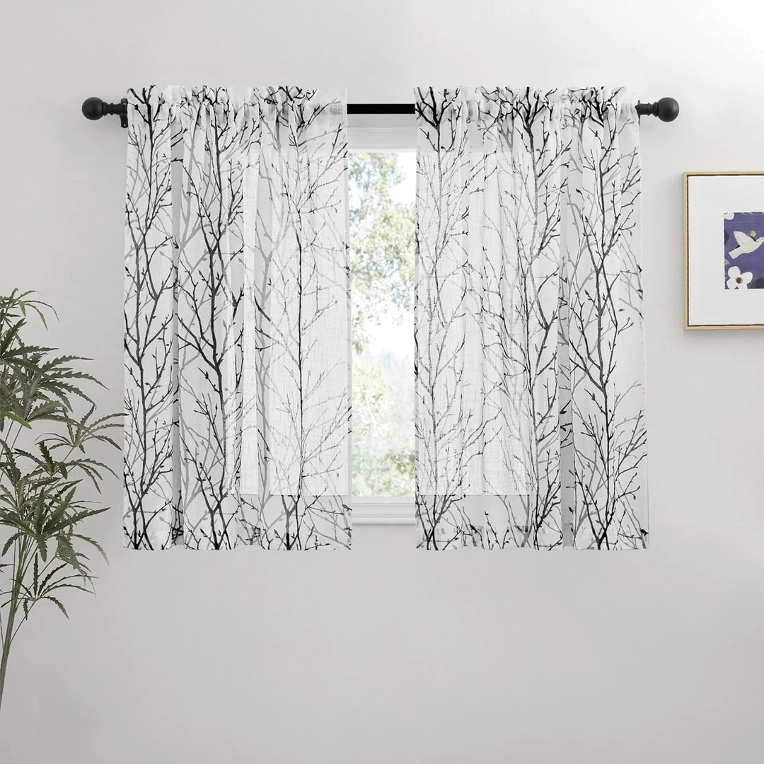Pair of black and grey branch-print sheer curtains