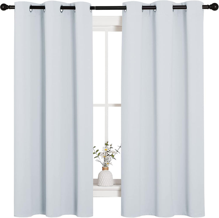 Pair of greyish white 42 x 63 inch blackout grommet curtain panels