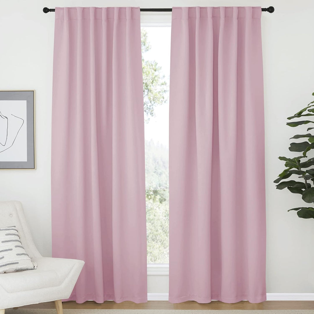 Baby pink 52 x 84 inch back-tab curtain pair in a room