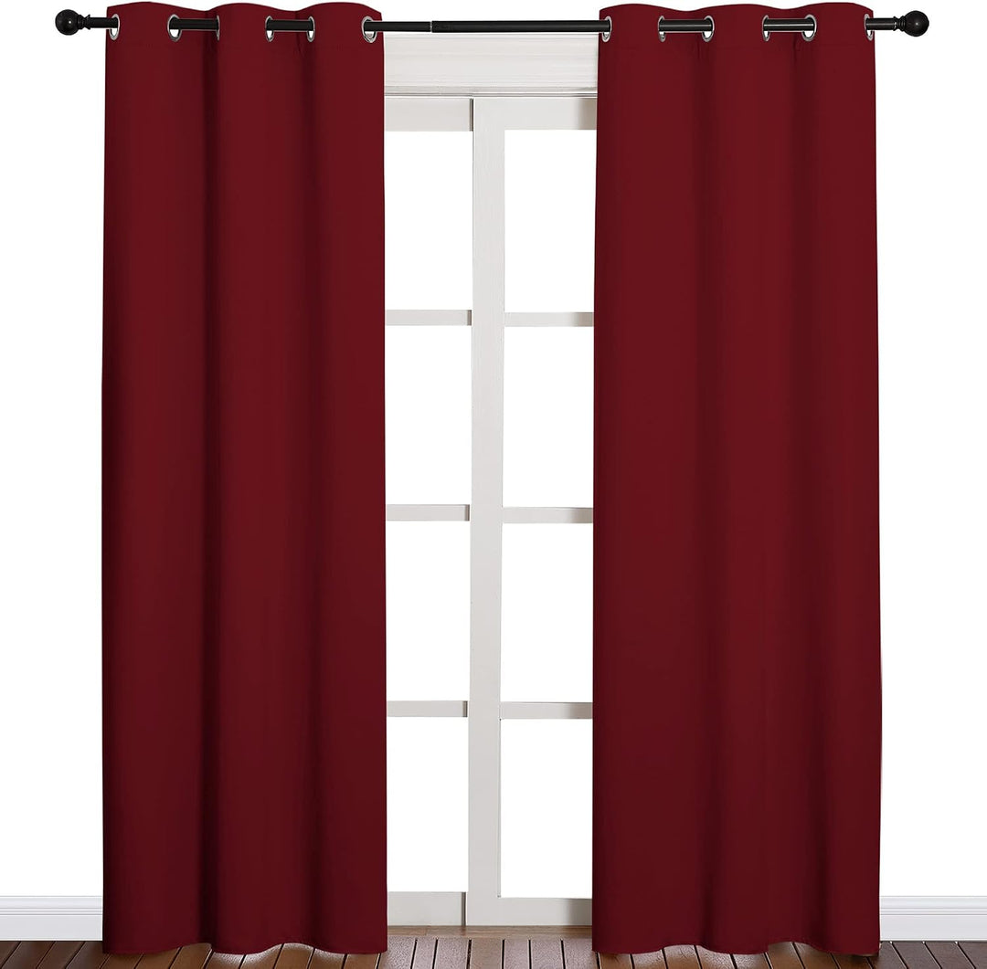 Burgundy red two-panel curtains on window