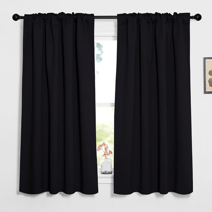 Black 52 by 63 inch rod-pocket curtain pair on window
