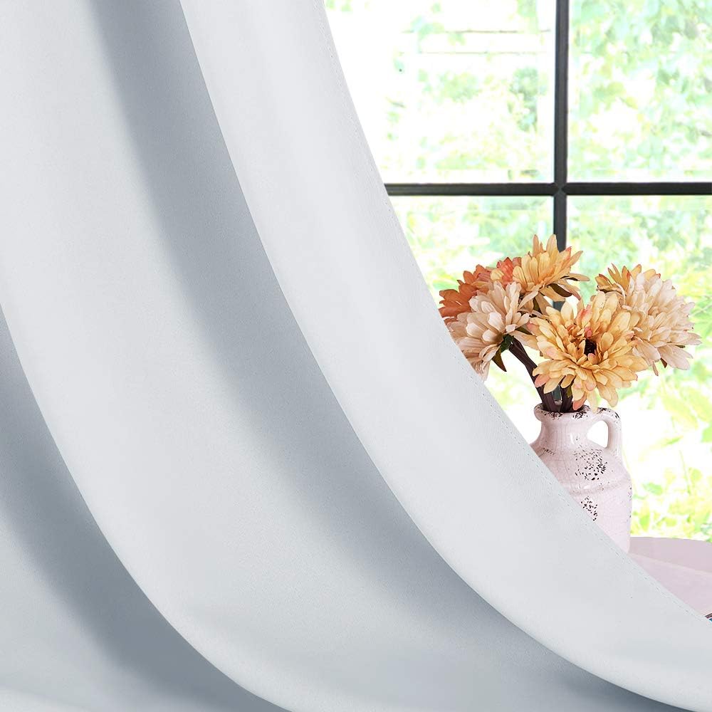 Greyish white curtain fabric drape