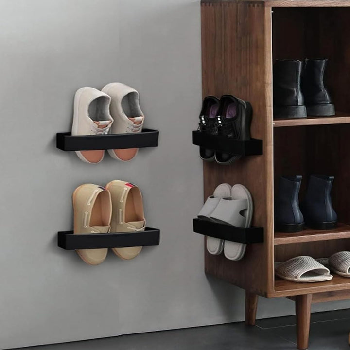 Four black adjustable wall-mounted shoe holders