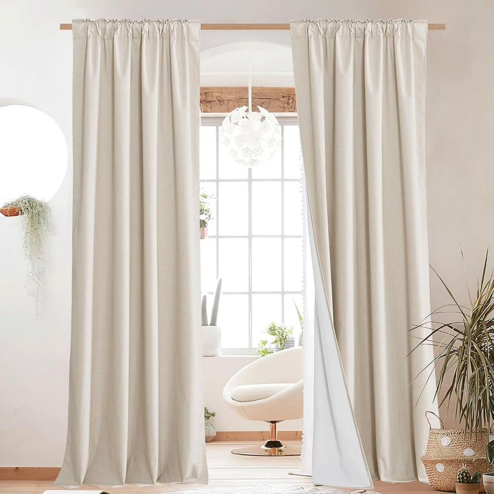 Beige blackout curtains with rod-pocket hanging, two panels