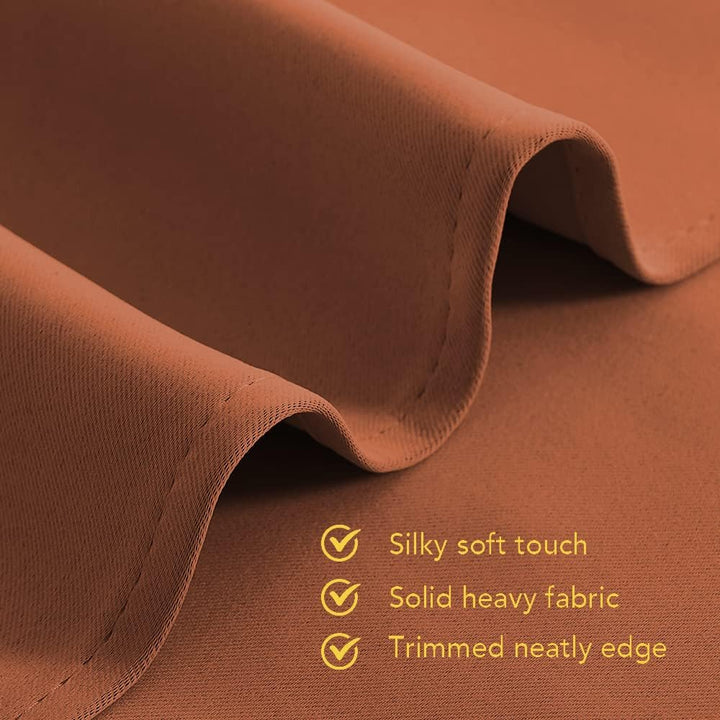 Close-up of burnt-orange blackout curtain fabric and hem