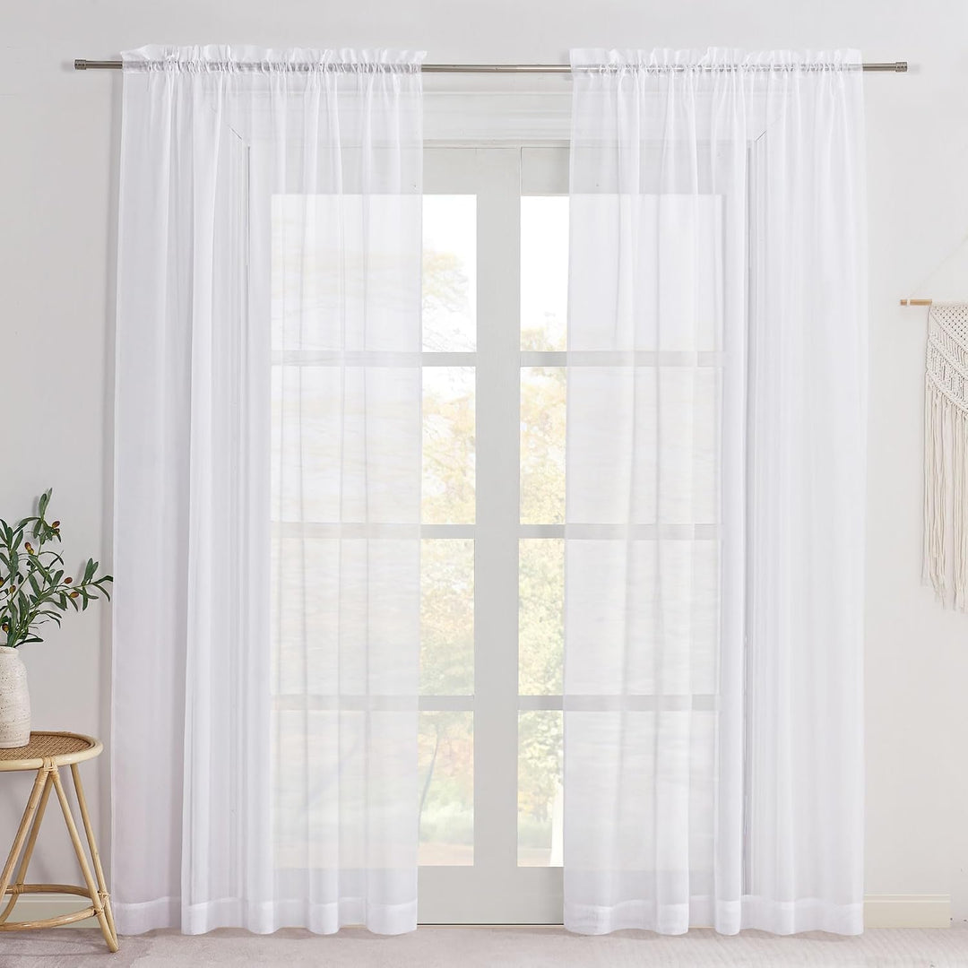 White sheer rod-pocket curtains, two 60 x 84-inch panels on a window