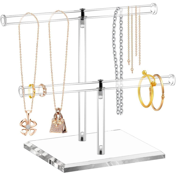 Clear T-bar stand displaying necklaces and bracelets