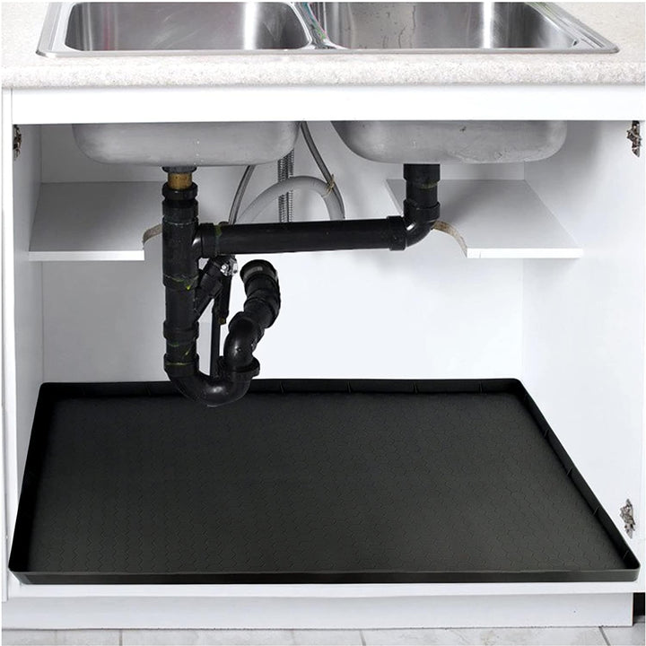 Under-sink cabinet mat fitted beneath a double kitchen sink